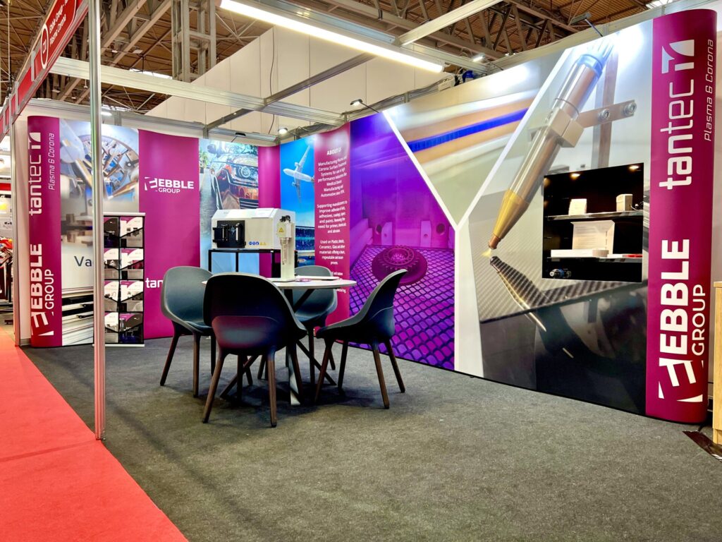 Stand at interplas 2023 with meeting area and vacuum plasma